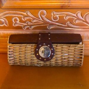 Selling vintage, leather & wicker MK clutch.